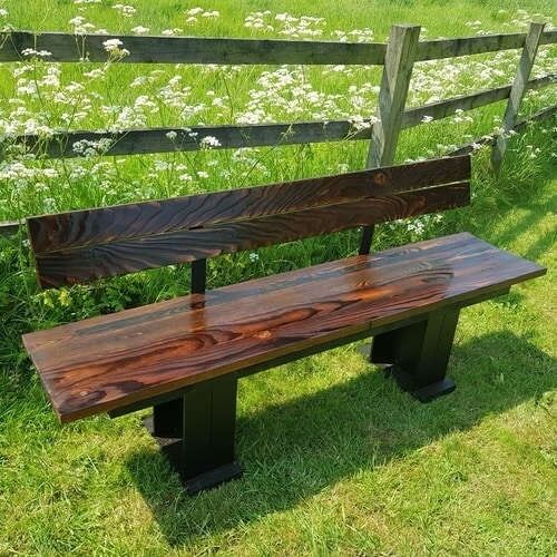 Brown bench with backrest Bench on grass
