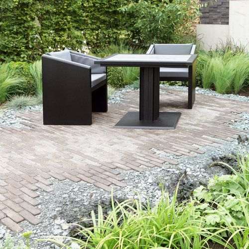 Grey Bistro table presented in a designer landscaped garden Large square ironfire bistro table with grey top and cushions